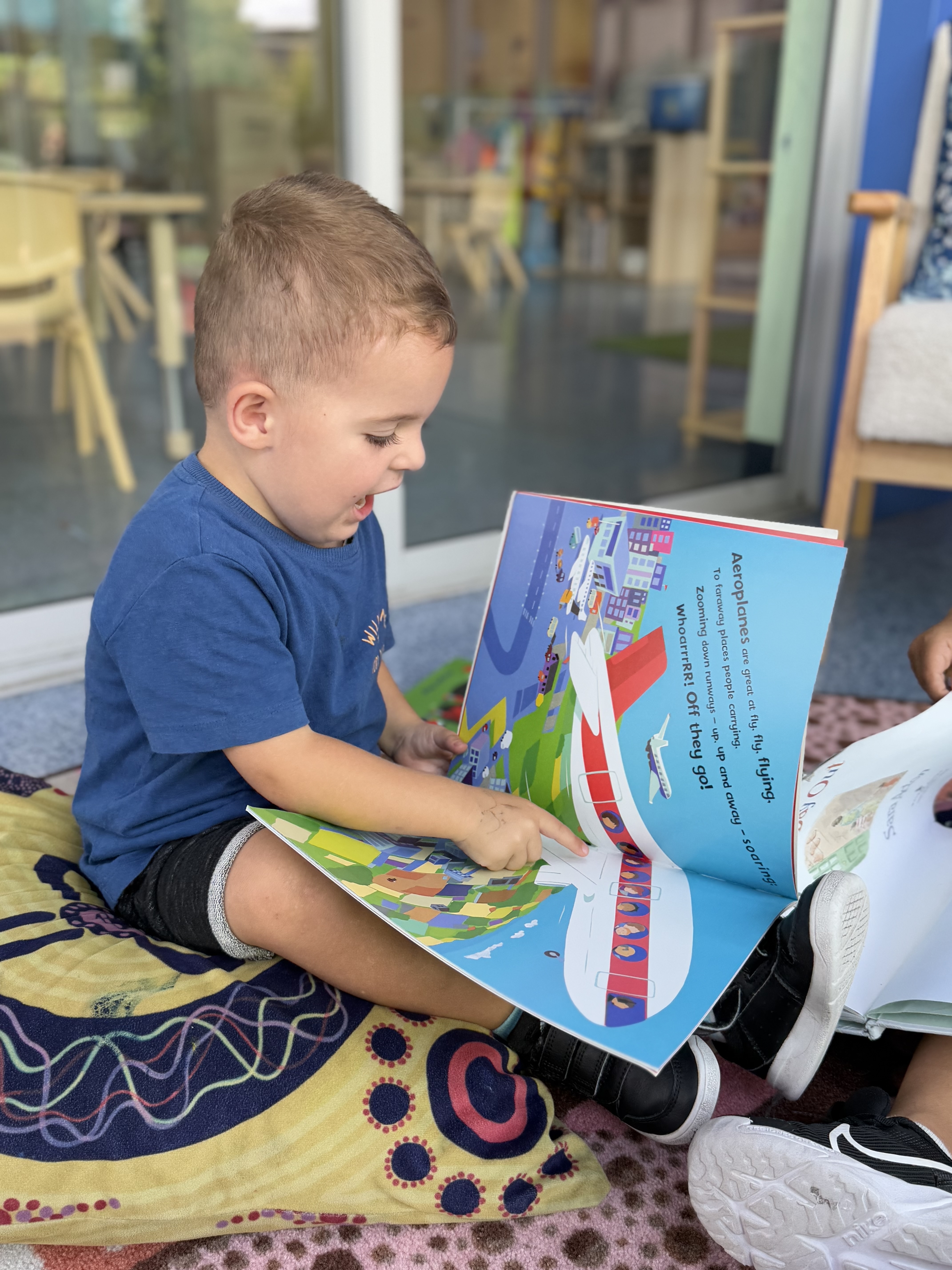 Child having fun reading a book